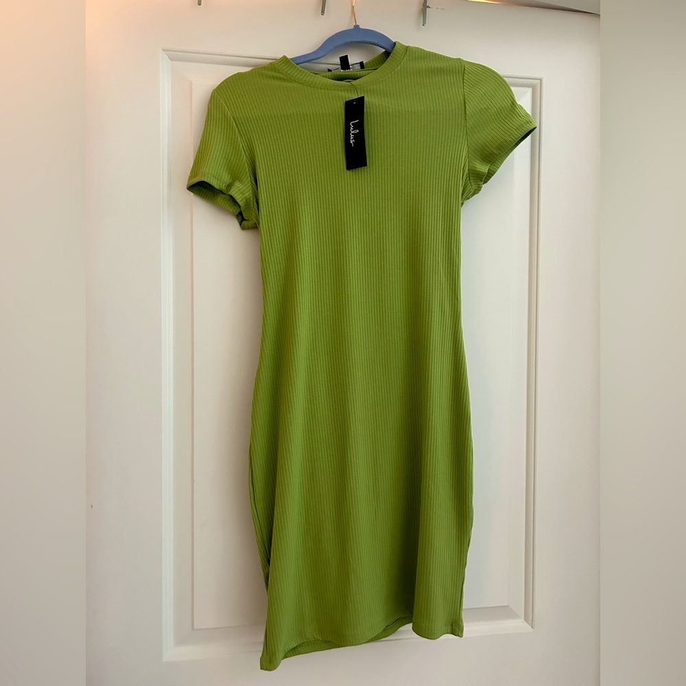 Green knit midi length dress with open back
